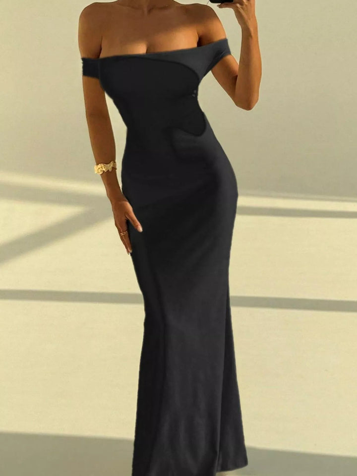 Backless Off-Shoulder Mermaid Dress featuring open back detail, fitted bodycon silhouette, elegant off-shoulder neckline, and floor-length flared hem.