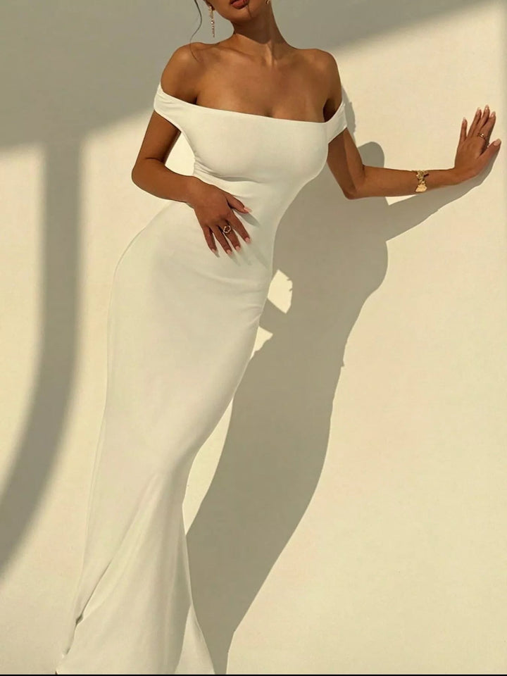Backless Off-Shoulder Mermaid Dress featuring open back detail, fitted bodycon silhouette, elegant off-shoulder neckline, and floor-length flared hem.