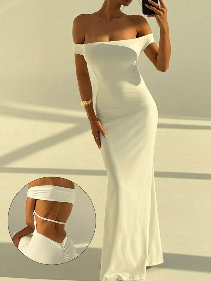 Backless Off-Shoulder Mermaid Dress featuring open back detail, fitted bodycon silhouette, elegant off-shoulder neckline, and floor-length flared hem.