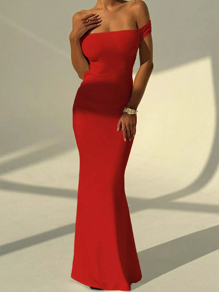 Backless Off-Shoulder Mermaid Dress featuring open back detail, fitted bodycon silhouette, elegant off-shoulder neckline, and floor-length flared hem.