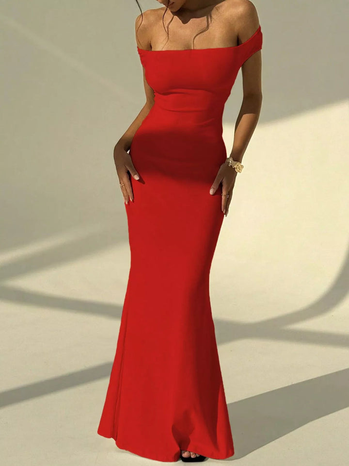 Backless Off-Shoulder Mermaid Dress featuring open back detail, fitted bodycon silhouette, elegant off-shoulder neckline, and floor-length flared hem.