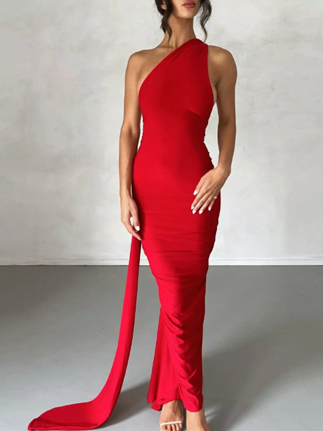 Backless One-Shoulder Bodycon Dress with ruched detailing, asymmetrical neckline, open back design, and elegant floor-length fitted silhouette.