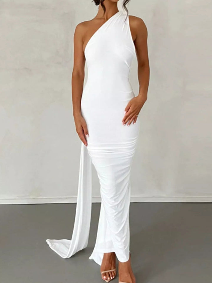Backless One-Shoulder Bodycon Dress with ruched detailing, asymmetrical neckline, open back design, and elegant floor-length fitted silhouette.