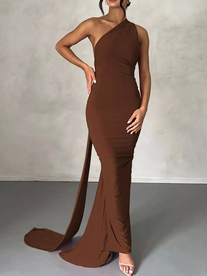 Backless One-Shoulder Bodycon Dress with ruched detailing, asymmetrical neckline, open back design, and elegant floor-length fitted silhouette.