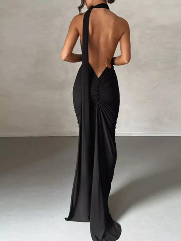 Backless One-Shoulder Bodycon Dress with ruched detailing, asymmetrical neckline, open back design, and elegant floor-length fitted silhouette.