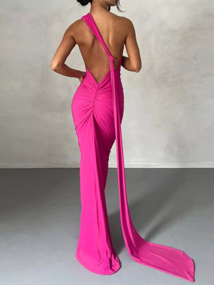 Backless One-Shoulder Bodycon Dress with ruched detailing, asymmetrical neckline, open back design, and elegant floor-length fitted silhouette.