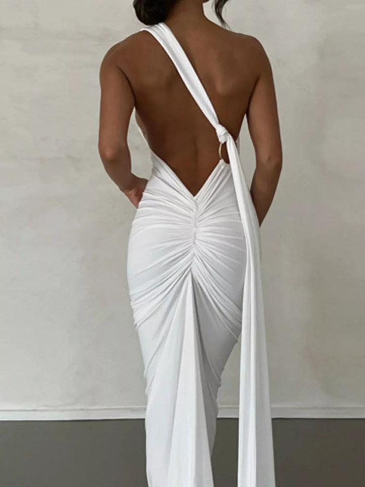 Backless One-Shoulder Bodycon Dress with ruched detailing, asymmetrical neckline, open back design, and elegant floor-length fitted silhouette.