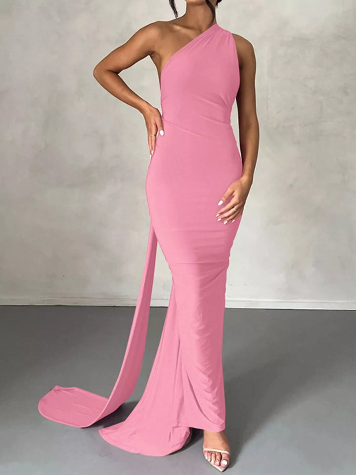 Backless One-Shoulder Bodycon Dress with ruched detailing, asymmetrical neckline, open back design, and elegant floor-length fitted silhouette.