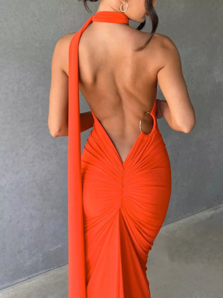 Backless One-Shoulder Bodycon Dress with ruched detailing, asymmetrical neckline, open back design, and elegant floor-length fitted silhouette.