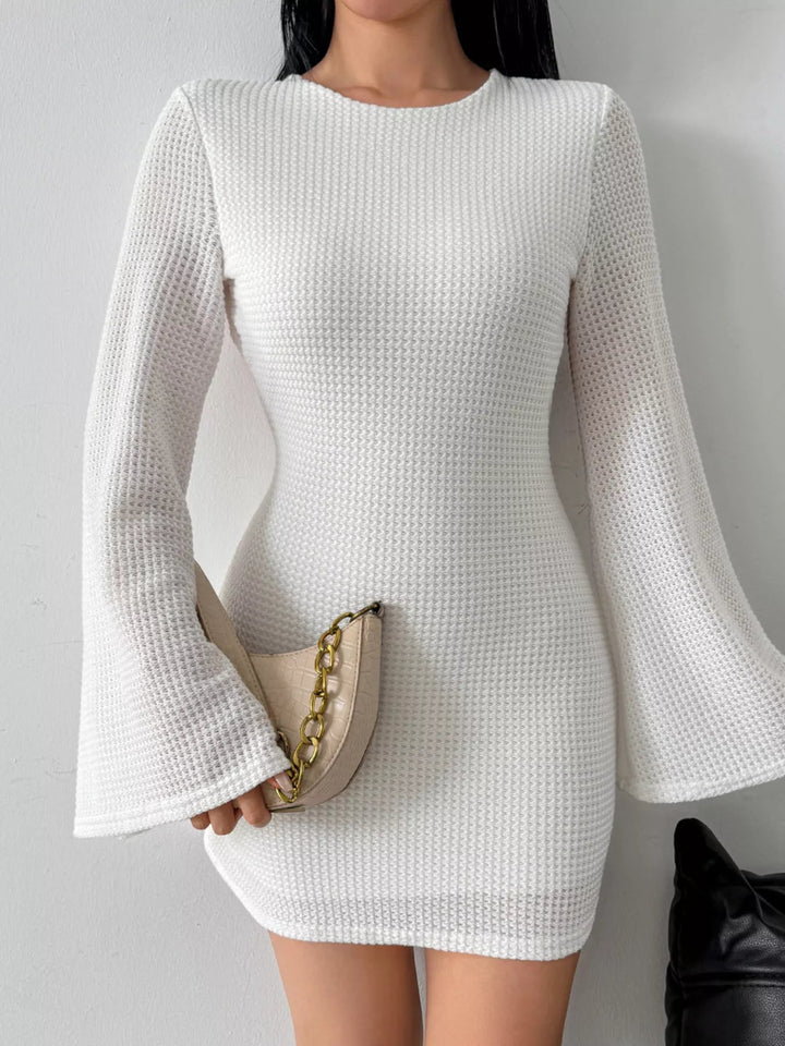 Backless Waffle Knit Dress with textured waffle fabric, flare sleeves, tied open back detail, and flattering mini length silhouette.