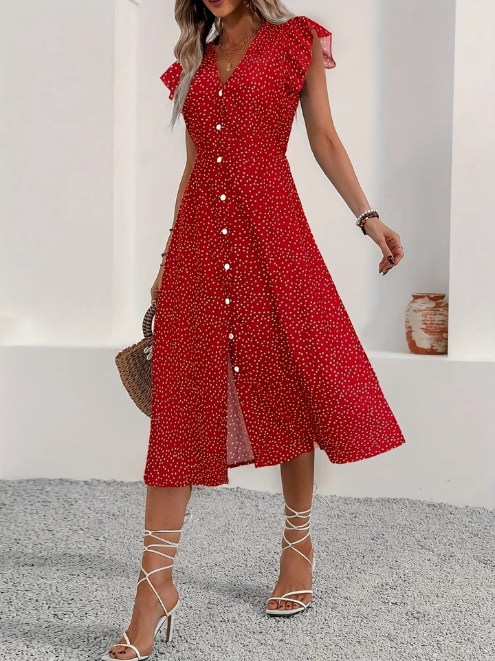 Button Front Ruffle Midi Dress with flutter sleeves, front buttons, and subtle slit in a flowing midi-length silhouette
