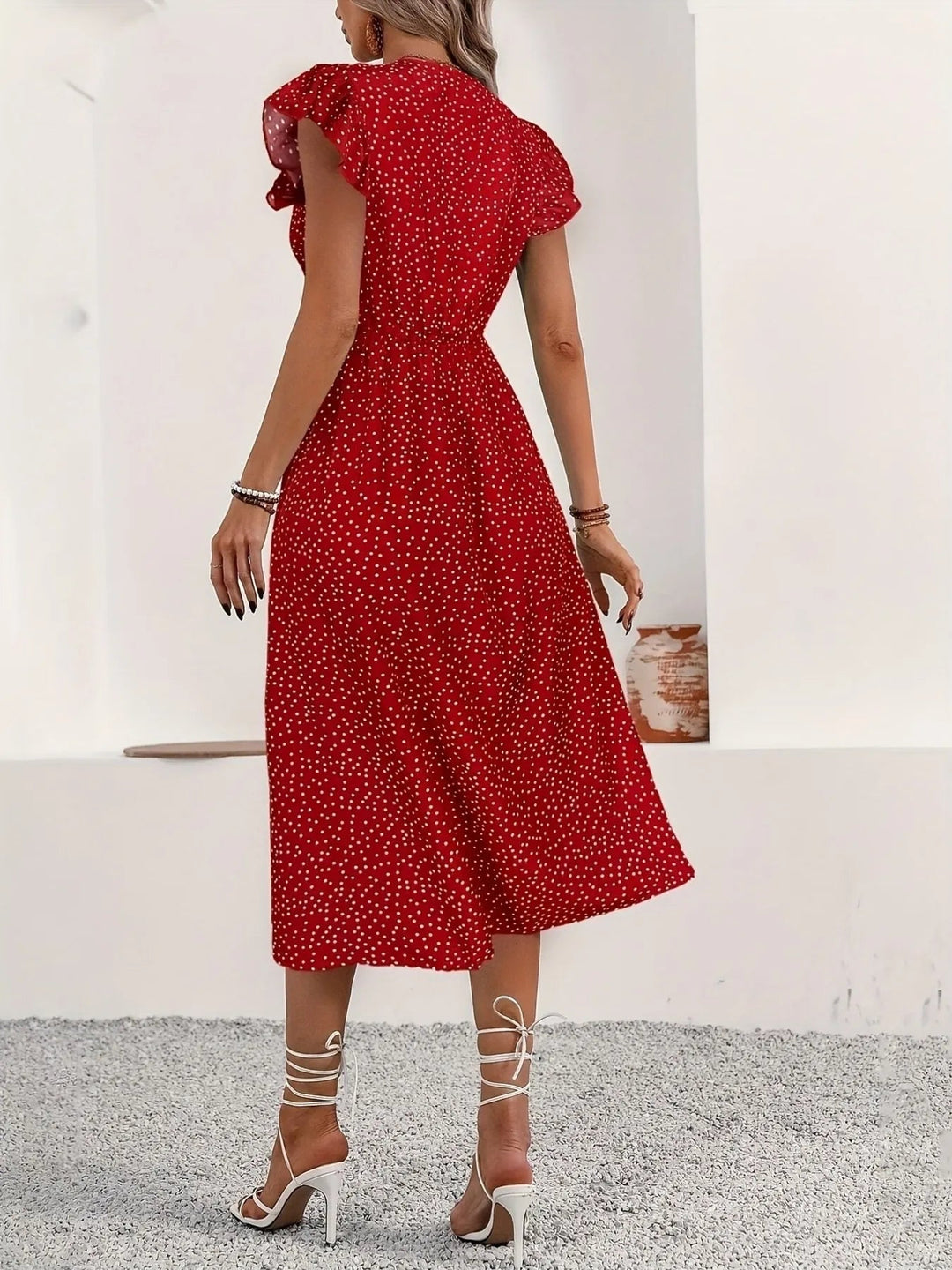 Button Front Ruffle Midi Dress with flutter sleeves, front buttons, and subtle slit in a flowing midi-length silhouette