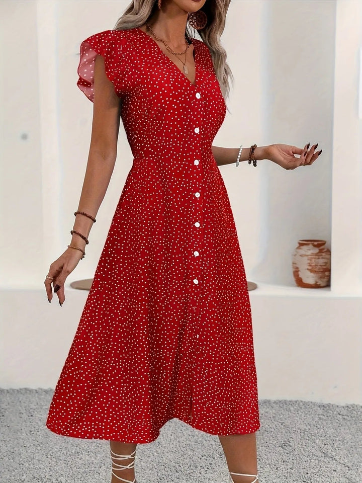 Button Front Ruffle Midi Dress with flutter sleeves, front buttons, and subtle slit in a flowing midi-length silhouette
