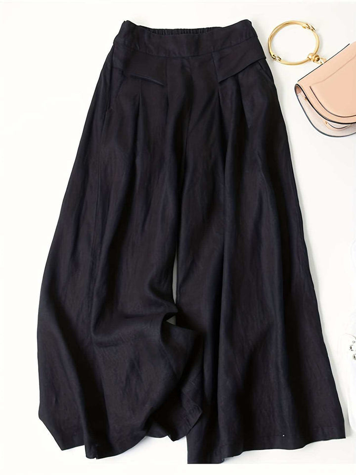 Women’s high waist wide-leg pants in solid black with elastic waistband and pockets, casual all-season trousers