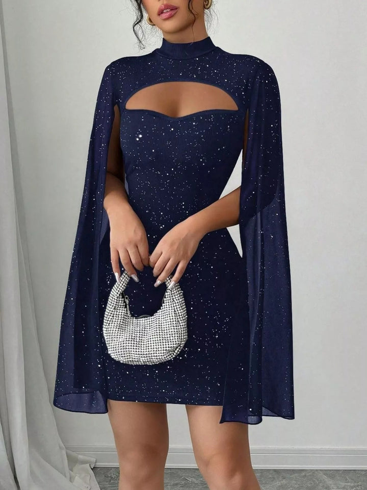 Glitter Cape Sleeve Mini Dress featuring shimmering fabric, elegant cape sleeves, subtle front cutout detail, and fitted bodycon mini silhouette.