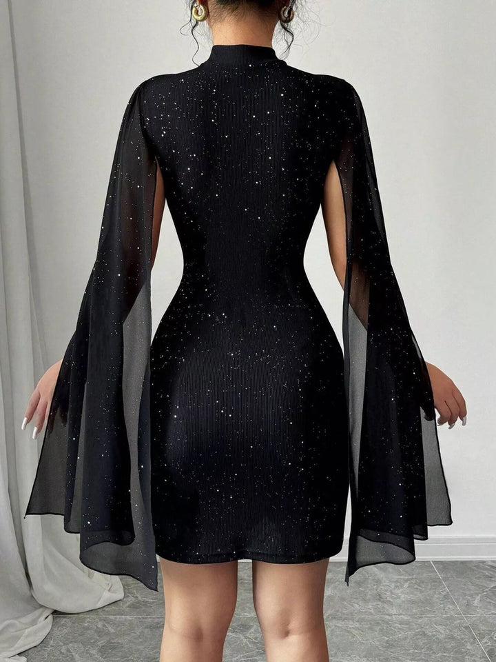 Glitter Cape Sleeve Mini Dress featuring shimmering fabric, elegant cape sleeves, subtle front cutout detail, and fitted bodycon mini silhouette.