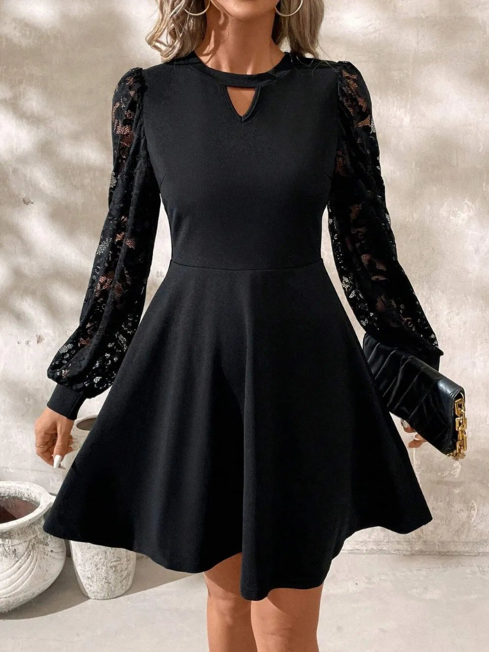 Lace Cutout Mini Dress with long sleeves, intricate lace detail, and fitted slightly stretchy silhouette in opaque fabric.
