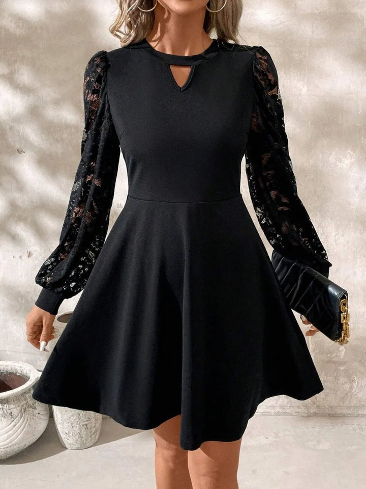 Lace Cutout Mini Dress with long sleeves, intricate lace detail, and fitted slightly stretchy silhouette in opaque fabric.