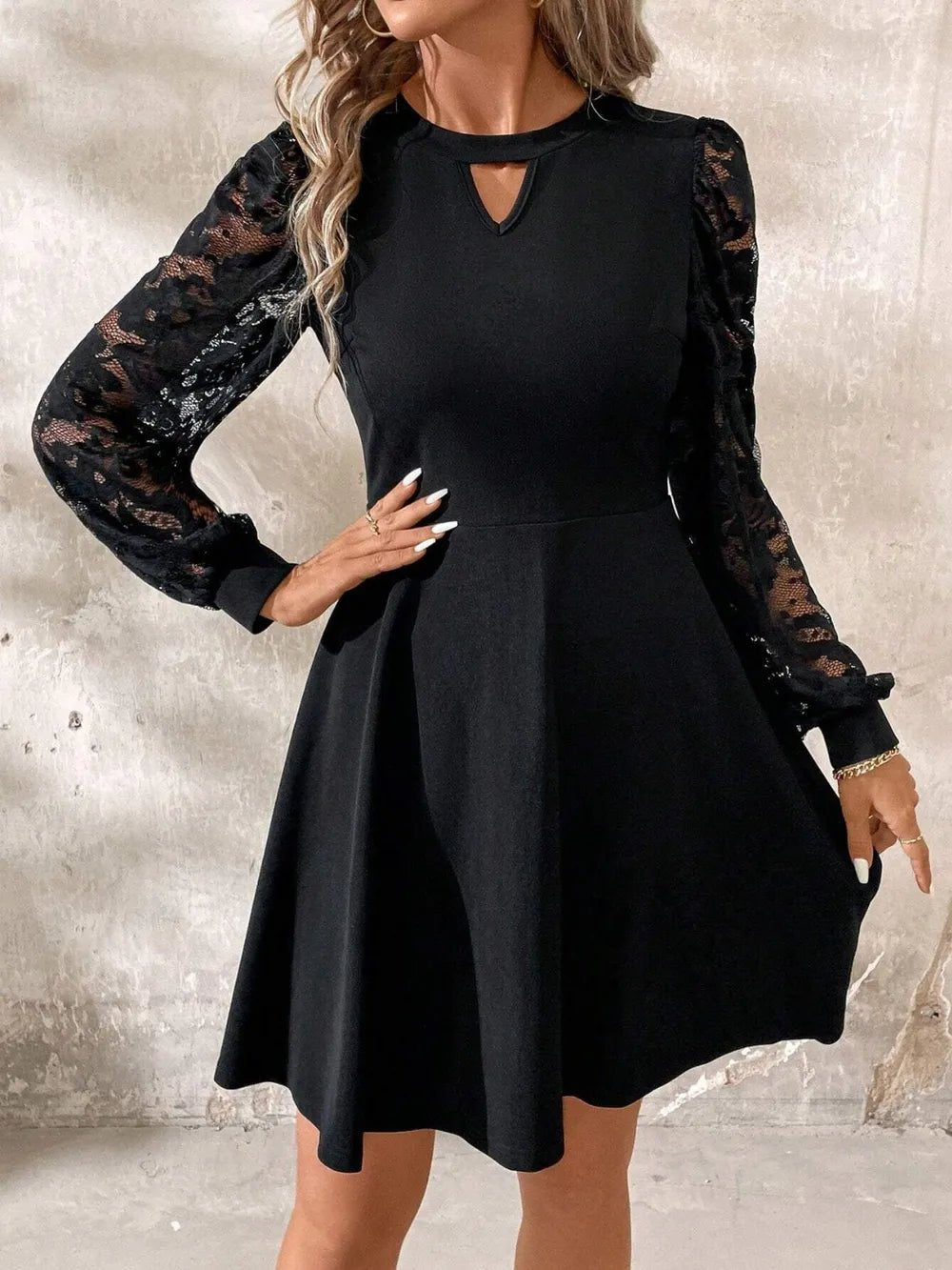 Lace Cutout Mini Dress with long sleeves, intricate lace detail, and fitted slightly stretchy silhouette in opaque fabric.