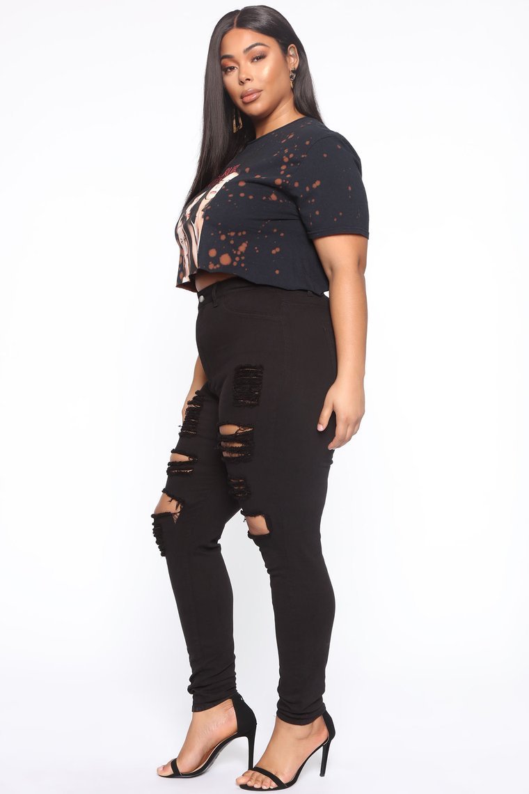 Women’s high waist ripped jeans made from stretch cotton with solid denim finish and full-length trouser fit