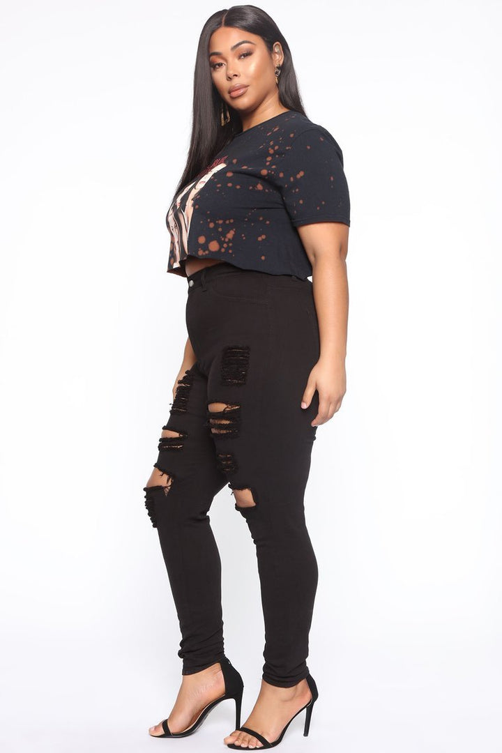 Women’s high waist ripped jeans made from stretch cotton with solid denim finish and full-length trouser fit