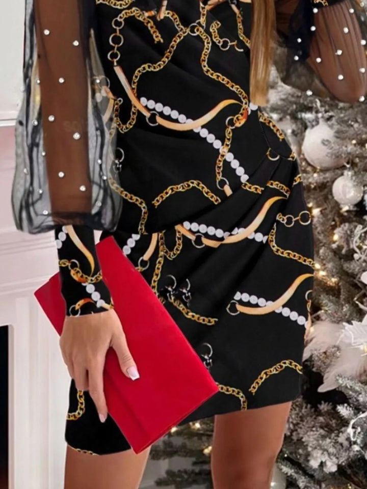 Floral Applique Bodycon Dress with sheer mesh sleeves, ruched detailing, delicate floral appliqué accents, and fitted curve-enhancing silhouette.