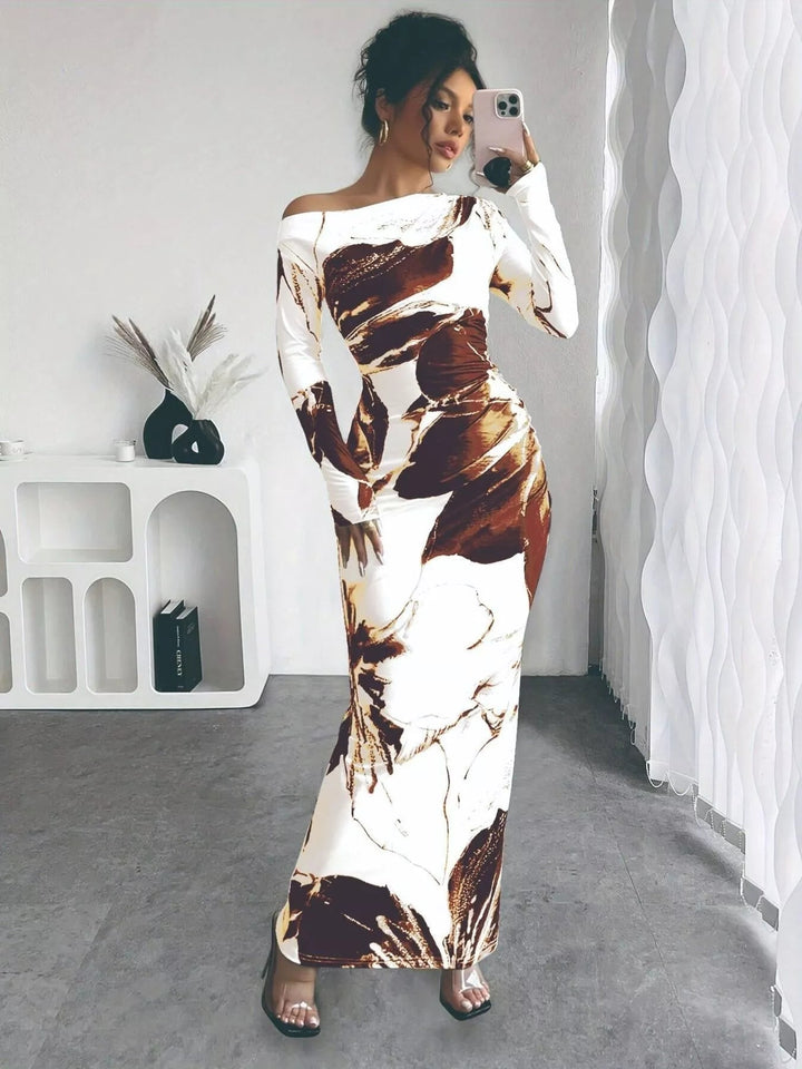 Floral One Shoulder Maxi dress with asymmetrical neckline, ruched waist detail, soft stretch fabric, flowing maxi length, and elegant floral print.