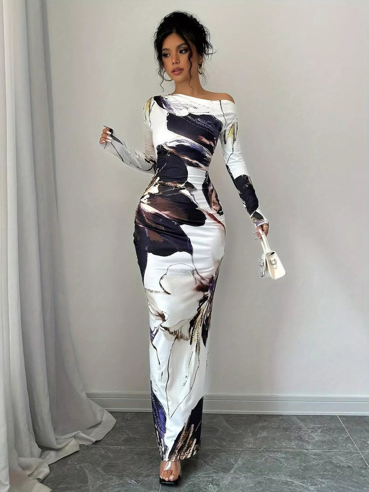 Floral One Shoulder Maxi dress with asymmetrical neckline, ruched waist detail, soft stretch fabric, flowing maxi length, and elegant floral print.