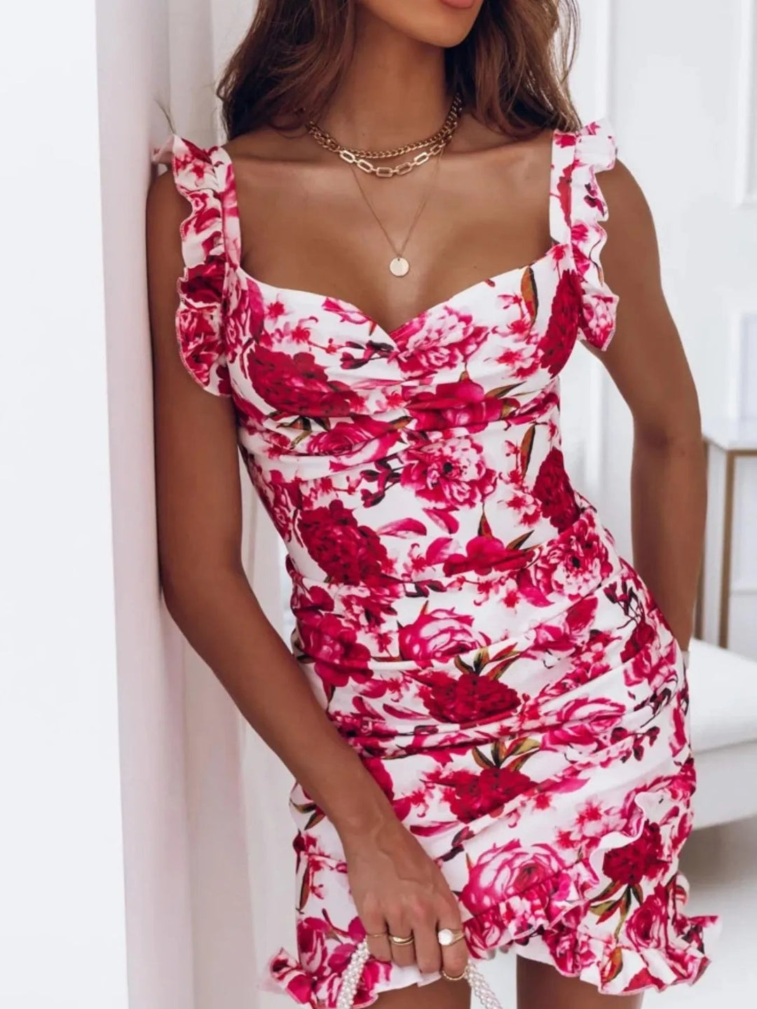 Floral Sweetheart Mini Dress with ruched bodice, ruffle straps, and fitted mini silhouette in elegant floral print