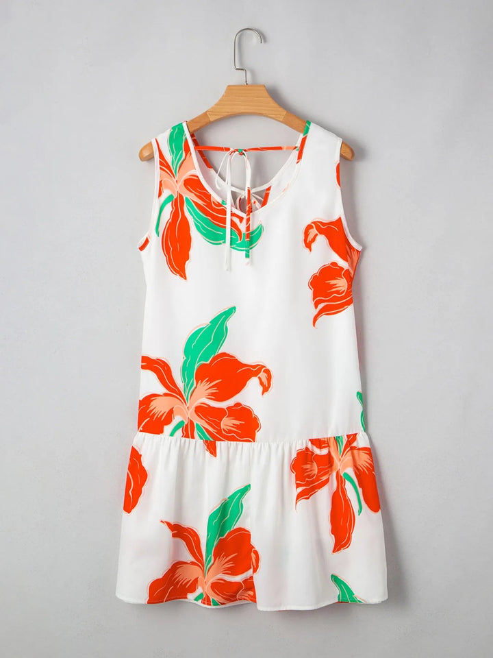 Floral Tie Neck Sundress with ruffled trim, sleeveless cut, and flowy silhouette in lightweight floral print fabric.