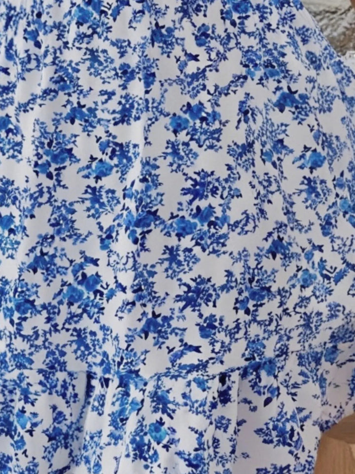 Plus Size Off-Shoulder Floral Dress with smocked neckline, side slit, and flowing midi silhouette in soft floral print