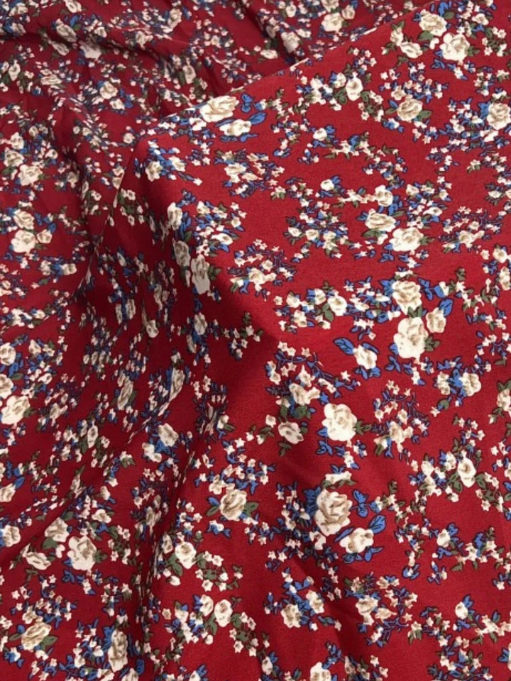 Plus Size Off-Shoulder Floral Dress with smocked neckline, side slit, and flowing midi silhouette in soft floral print