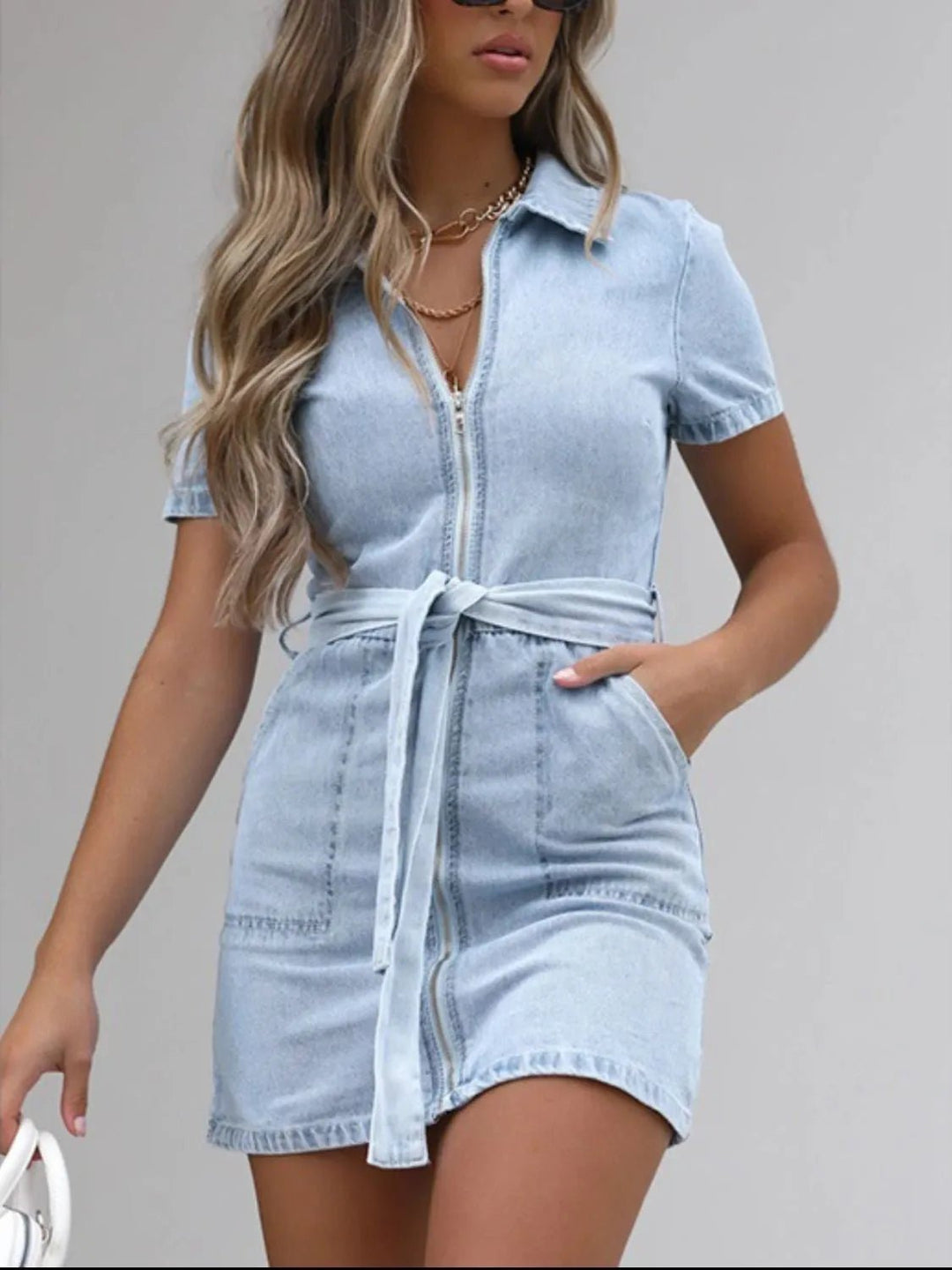 Plus Size Zip Front Denim Dress with short sleeves, adjustable tie waist, functional pockets, and flattering structured silhouette