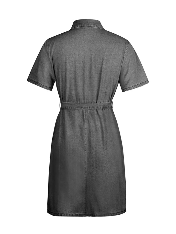 Plus Size Zip Front Denim Dress with short sleeves, adjustable tie waist, functional pockets, and flattering structured silhouette