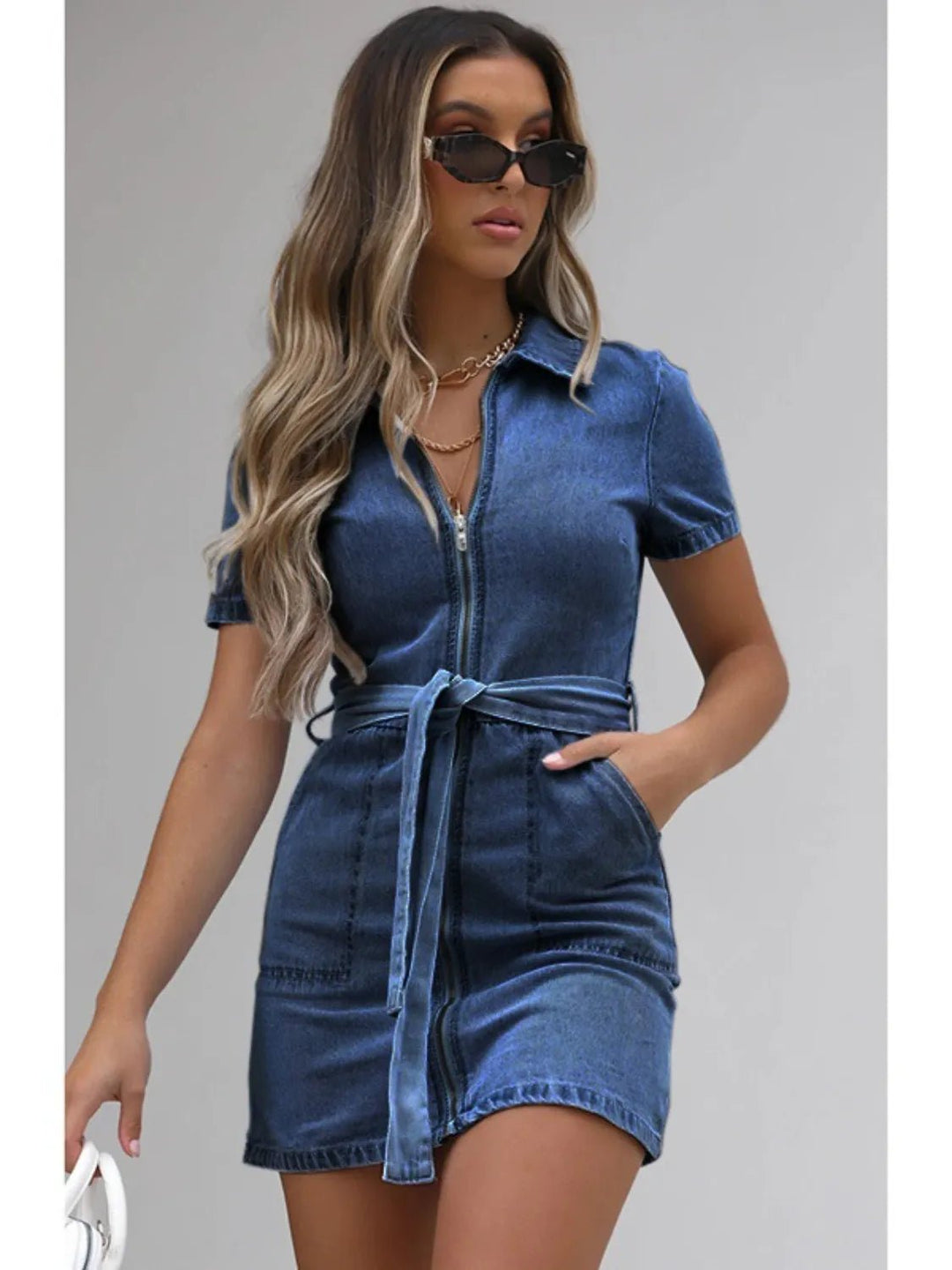 Plus Size Zip Front Denim Dress with short sleeves, adjustable tie waist, functional pockets, and flattering structured silhouette