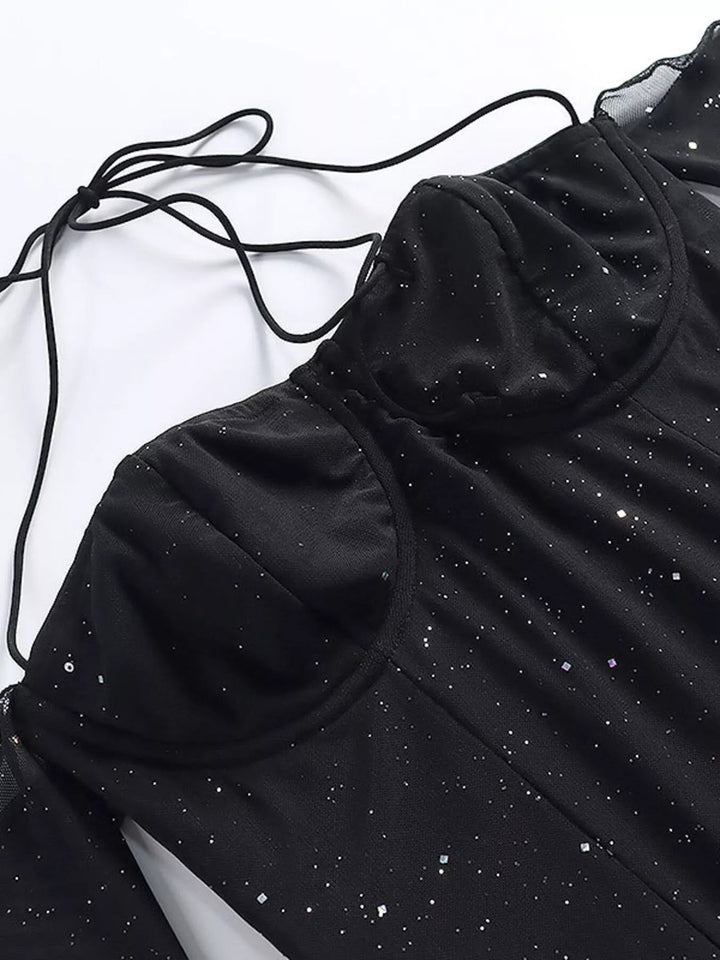 Glitter Mini Dress Sleeves with sheer long sleeves, side split detail, body-contouring mini silhouette, and refined shimmering fabric.