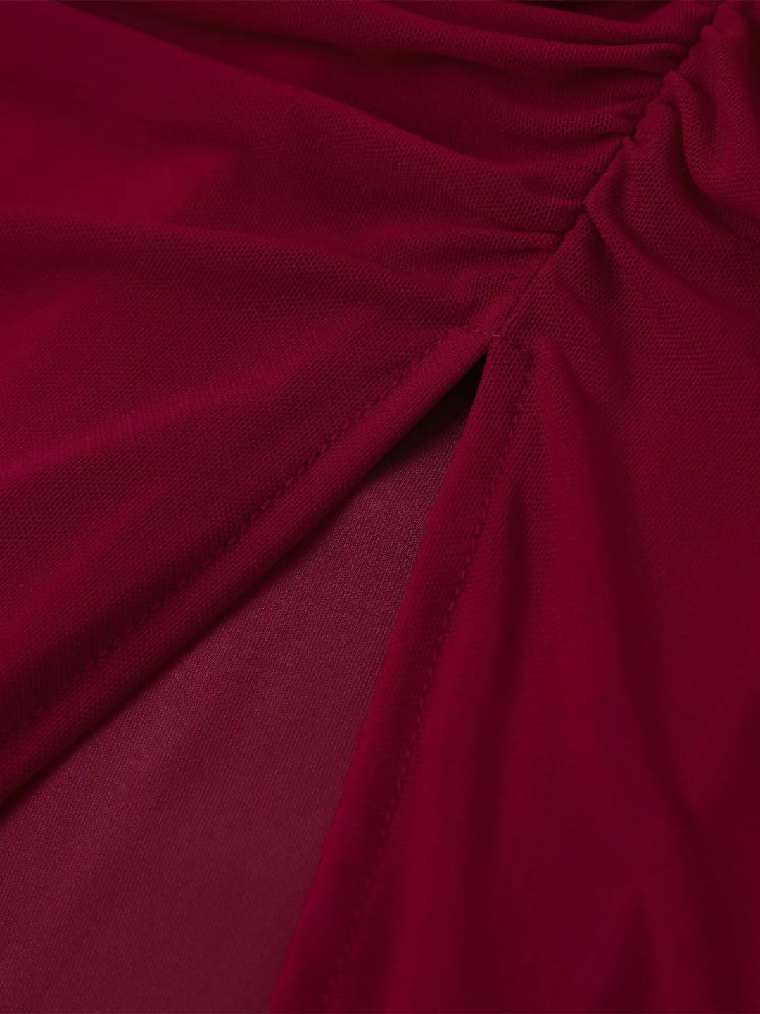 Halter Neck Ruched Slit Dress featuring sculpted ruched bodice, sheer mesh detail, high side slit, adjustable waist tie, and fitted floor-length maxi silhouette.