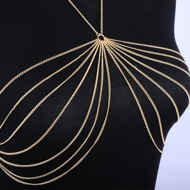 Metal body chain necklace displayed on a black mannequin, featuring intricate gold chain design and elegant draping.
