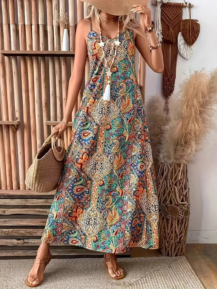 Paisley Print Maxi Dress with V-neckline and flowing full-length silhouette in an elegant paisley patterned fabric