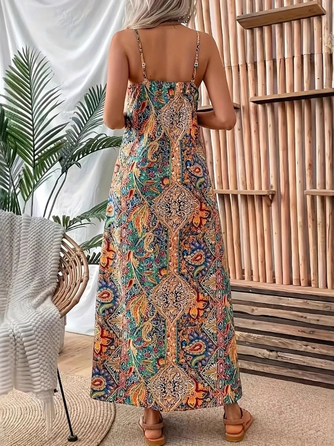 Paisley Print Maxi Dress with V-neckline and flowing full-length silhouette in an elegant paisley patterned fabric