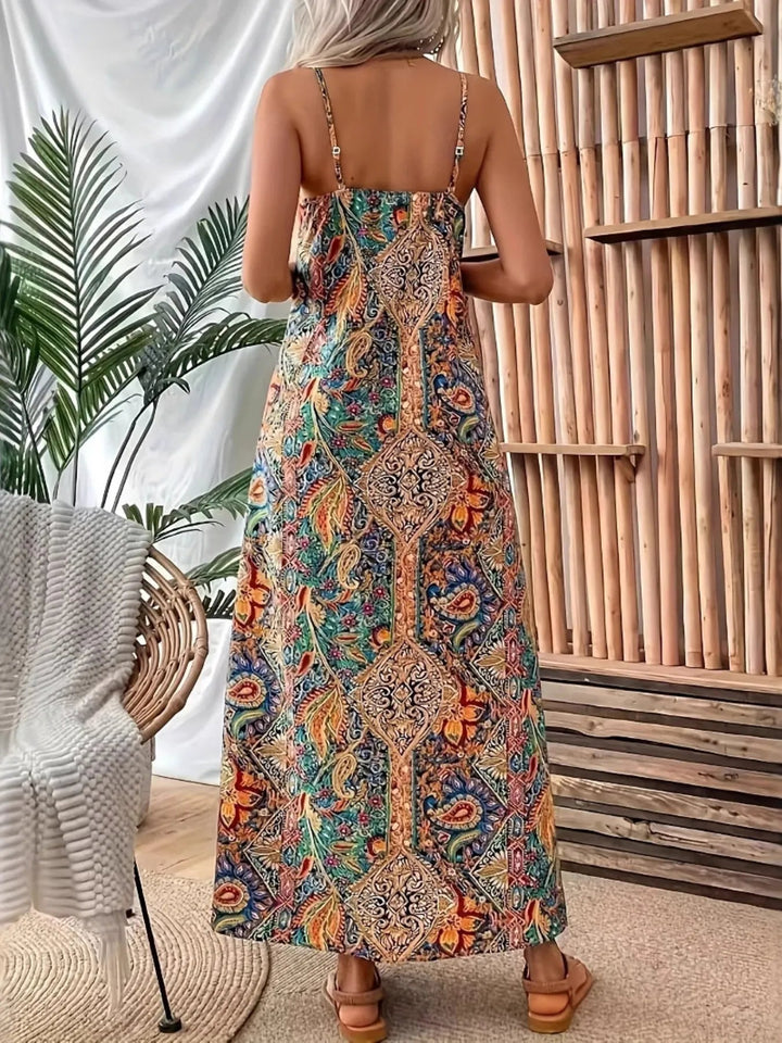 Paisley Print Maxi Dress with V-neckline and flowing full-length silhouette in an elegant paisley patterned fabric