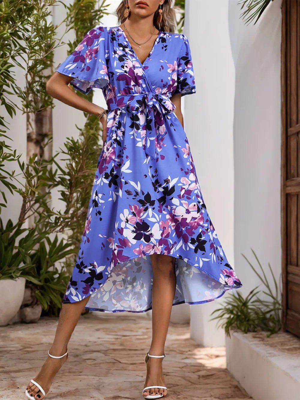 High-Low Printed Midi Dress with surplice neckline, tie waist detail, short sleeves, and flowing asymmetrical hemline.