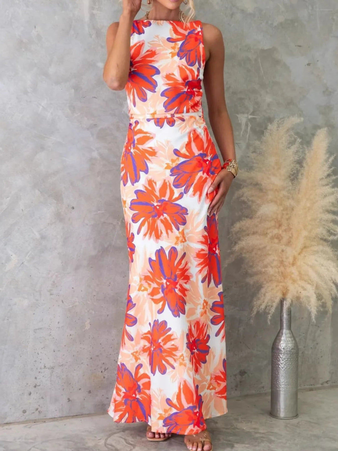 Printed Backless Maxi Dress with sleeveless design, flowing full-length silhouette, and elegant open back detail