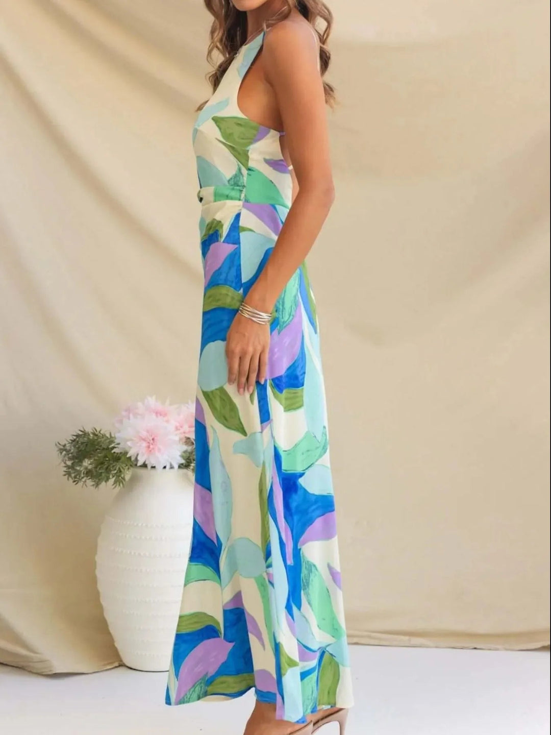 Printed Backless Maxi Dress with sleeveless design, flowing full-length silhouette, and elegant open back detail