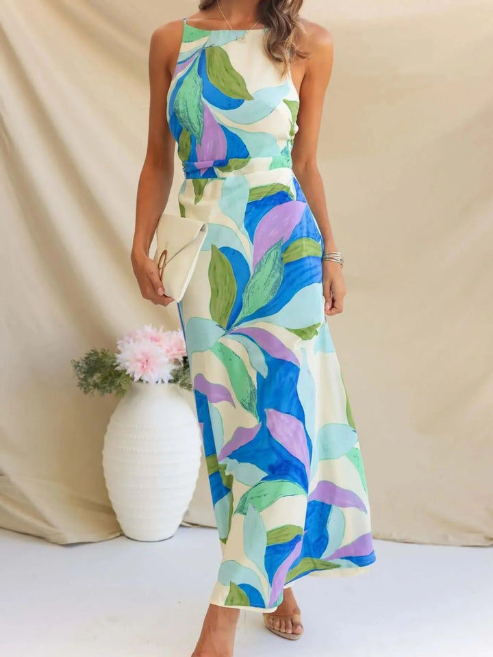 Printed Backless Maxi Dress with sleeveless design, flowing full-length silhouette, and elegant open back detail
