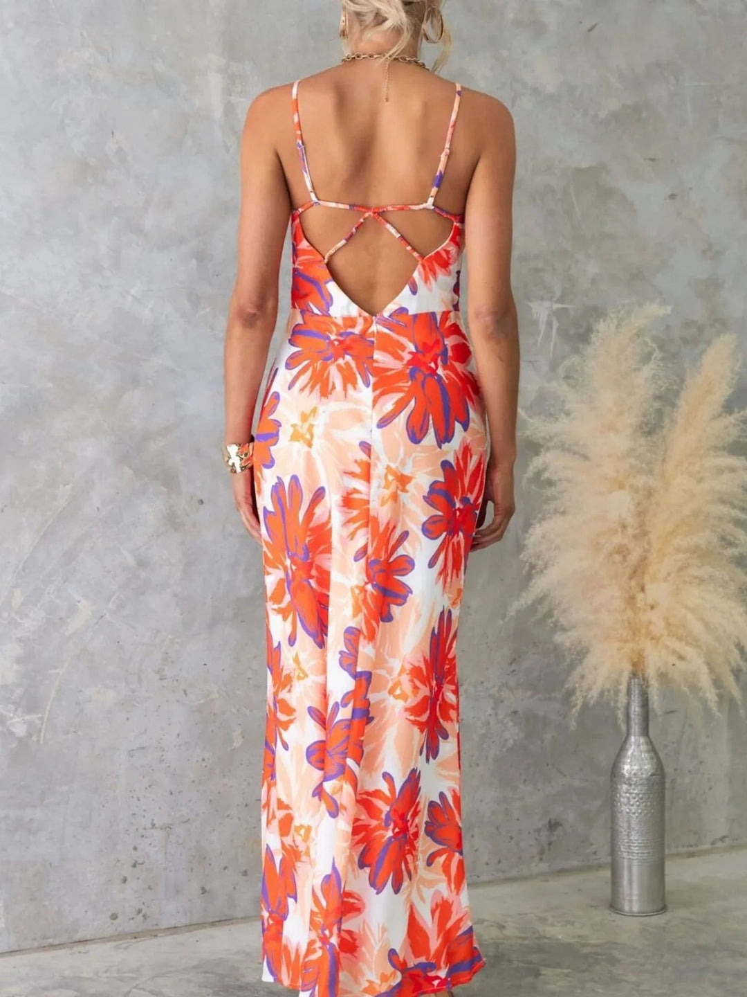 Printed Backless Maxi Dress with sleeveless design, flowing full-length silhouette, and elegant open back detail
