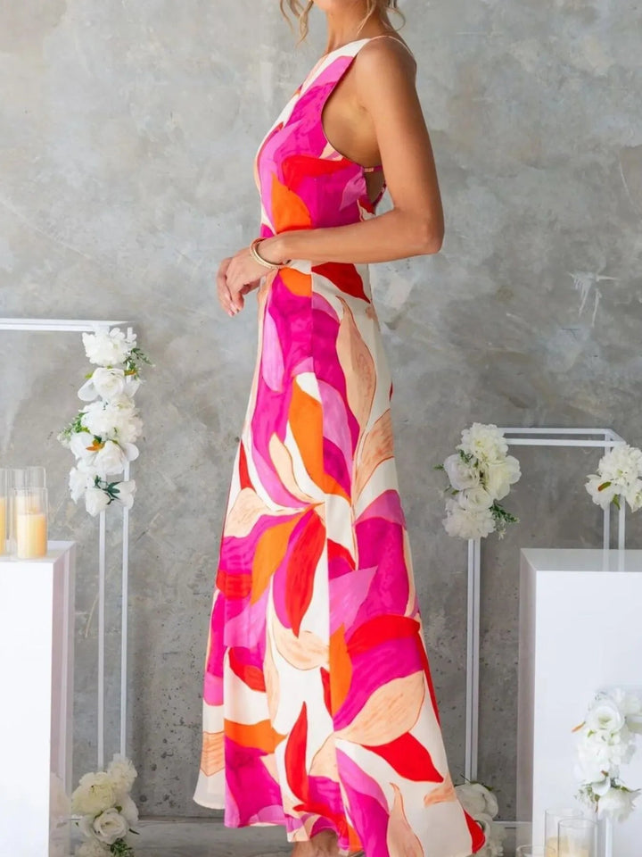Printed Backless Maxi Dress with sleeveless design, flowing full-length silhouette, and elegant open back detail