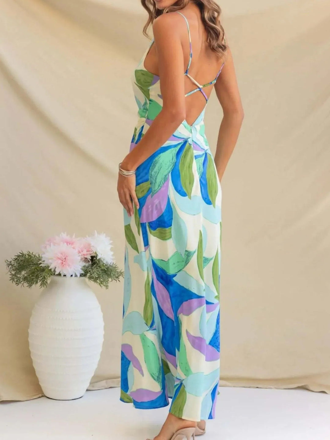 Printed Backless Maxi Dress with sleeveless design, flowing full-length silhouette, and elegant open back detail