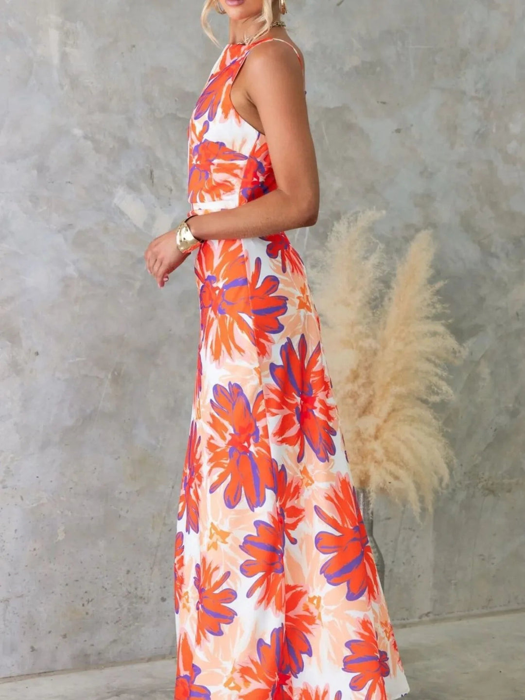Printed Backless Maxi Dress with sleeveless design, flowing full-length silhouette, and elegant open back detail