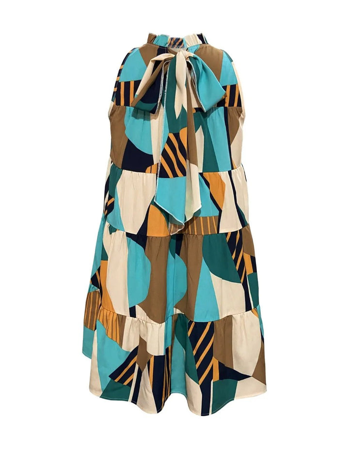 Printed Mock Neck Dress with mini length, high neckline, long sleeves, and bold allover print design.